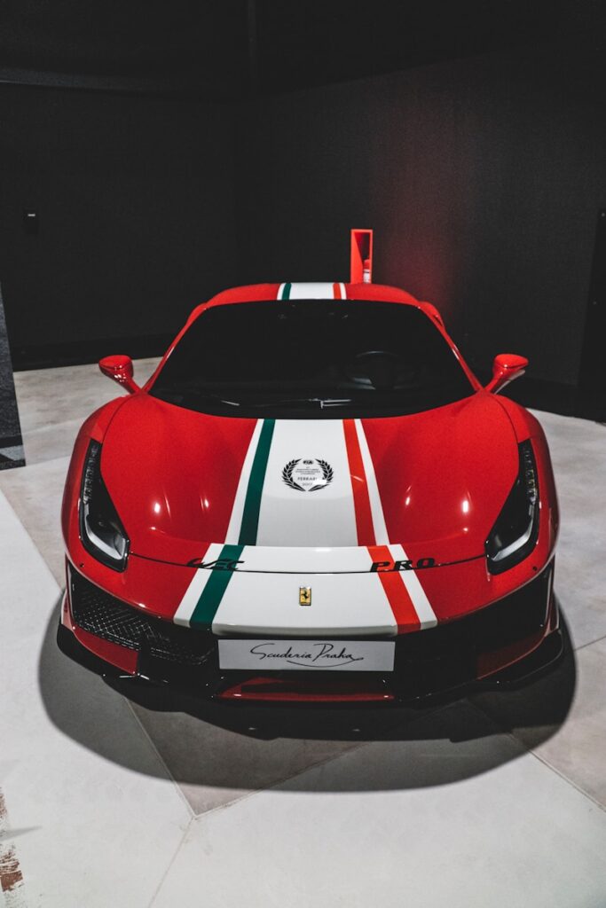 a red sports car with white and green stripes
