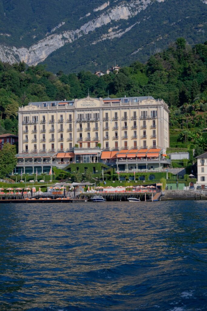 A large hotel on the shore of a lake